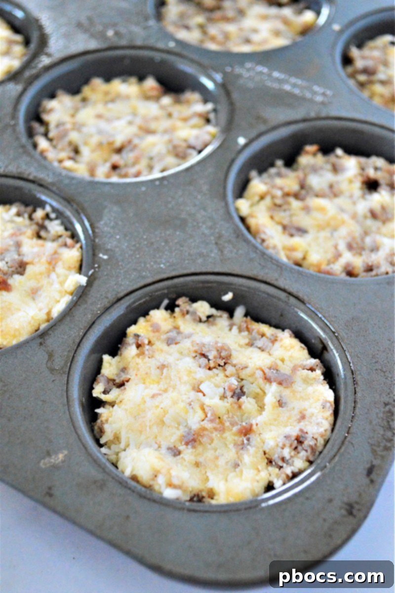 Filling muffin tins with Keto Sausage Muffin batter