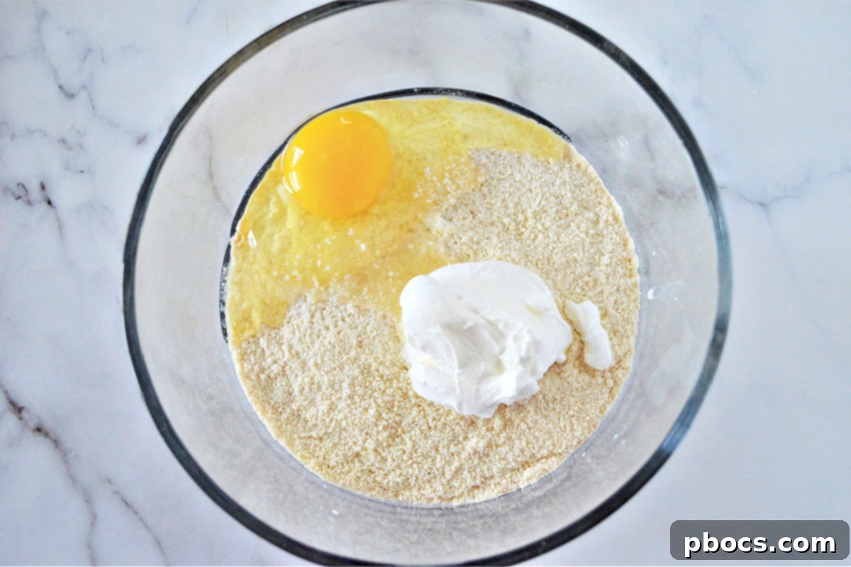 Adding sour cream and egg to the mixture