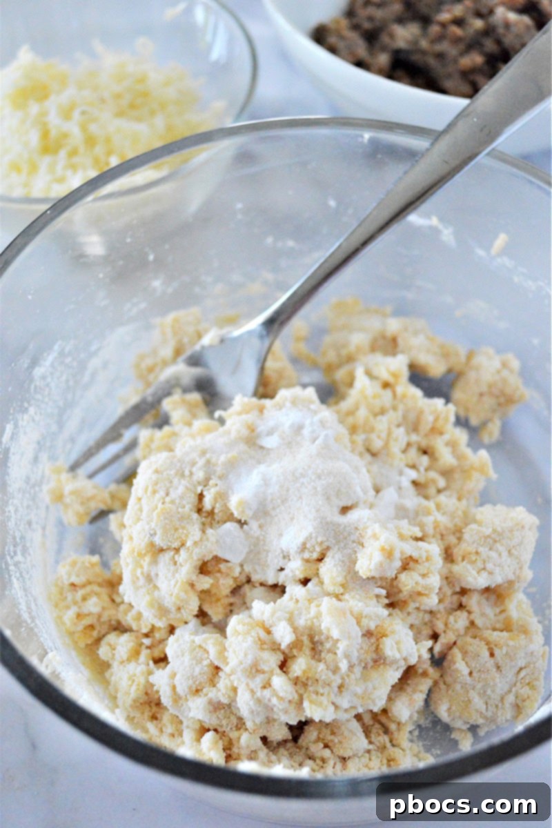 Seasoning the muffin batter with salt, garlic salt, and baking powder