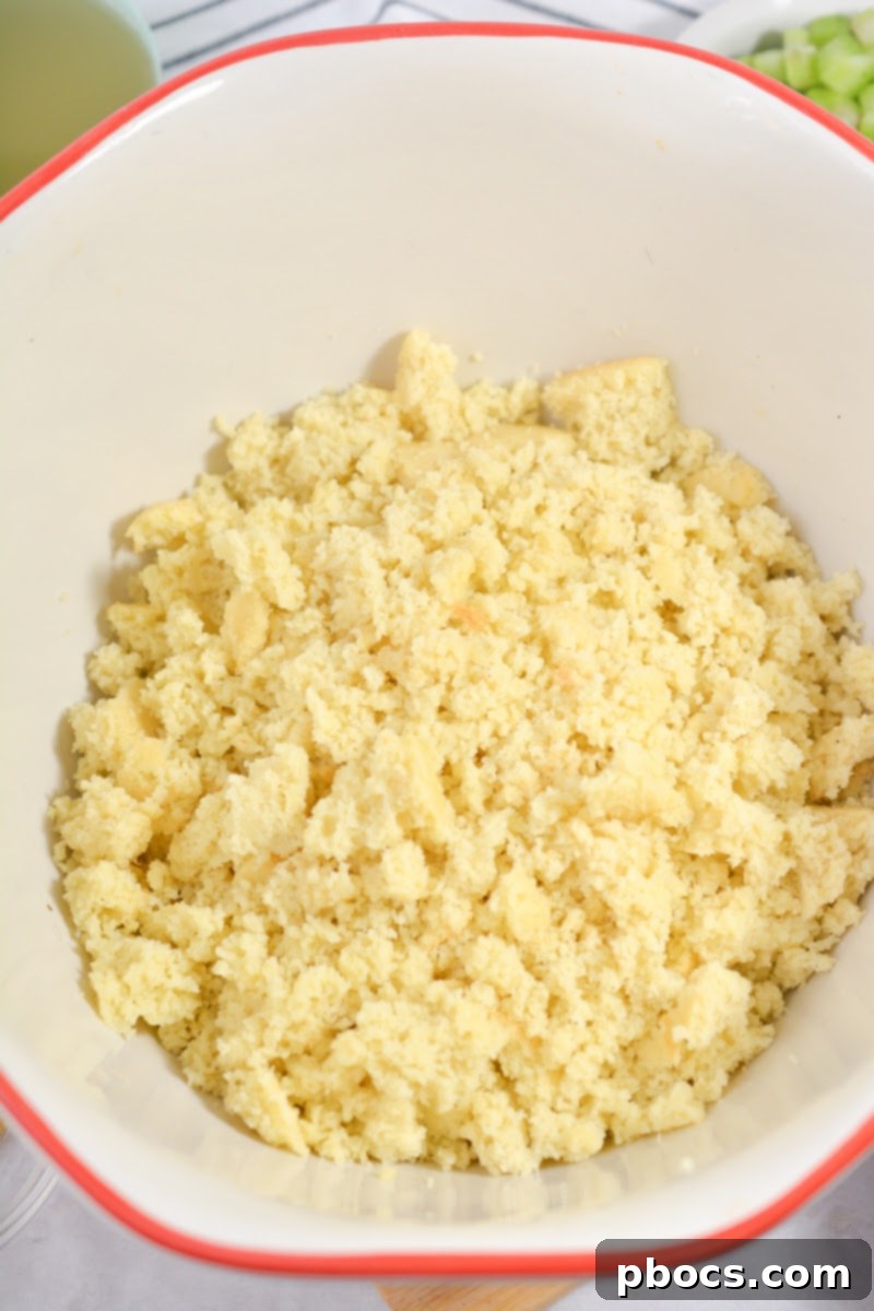 Crumbling cooked keto cornbread into a bowl