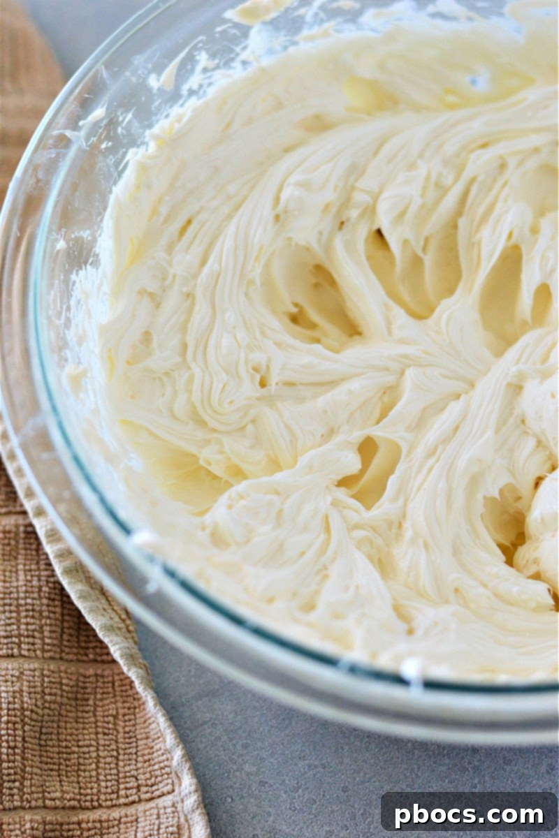 Pouring the creamy cheesecake mixture over the prepared crust