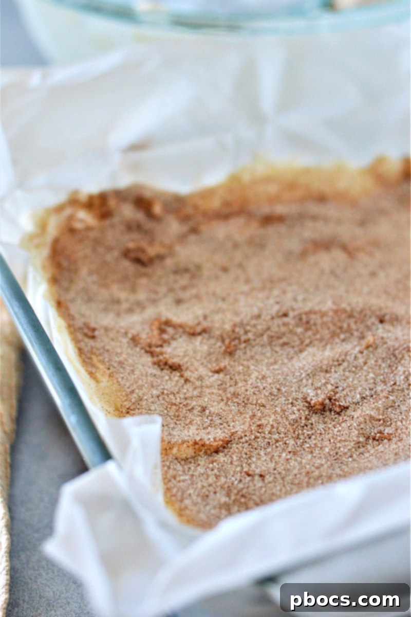 Keto No-Bake Churro Cheesecake Bars setting in the freezer until firm