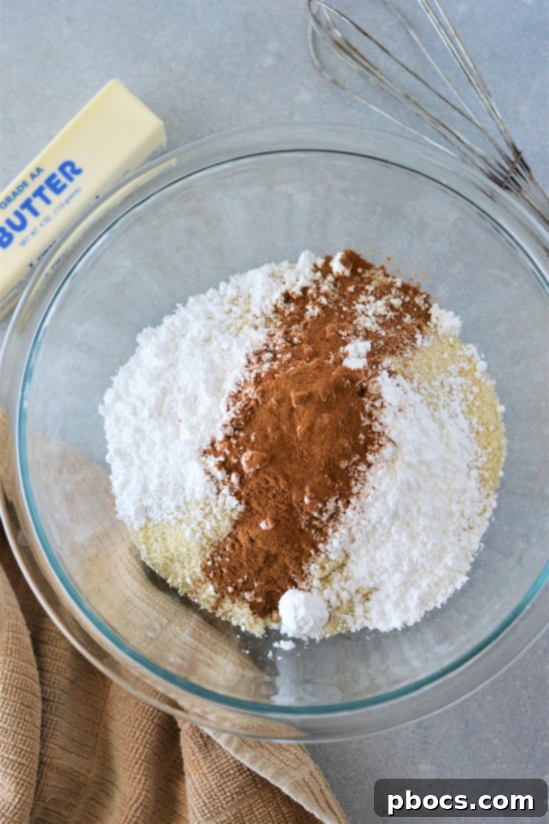 Mixing almond flour, cinnamon, and powdered sugar substitute for the crust