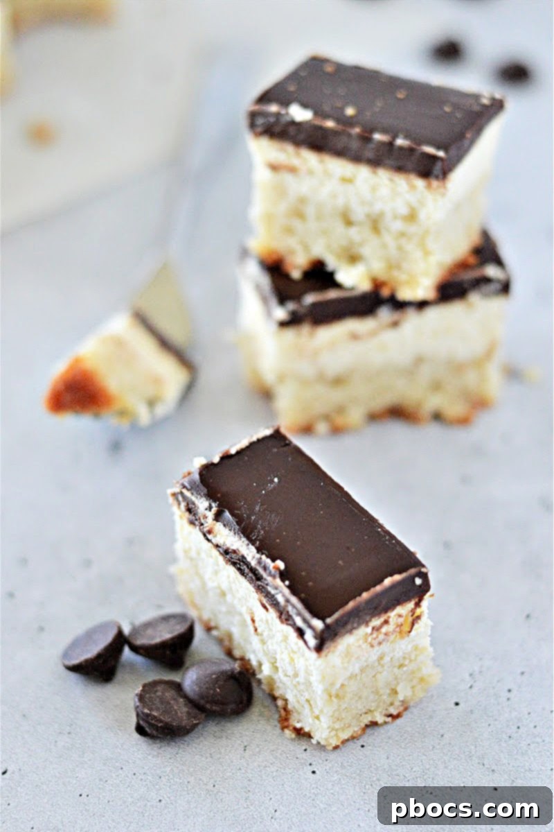 Classic Boston Cream Pie with layers of cake, cream, and chocolate topping.