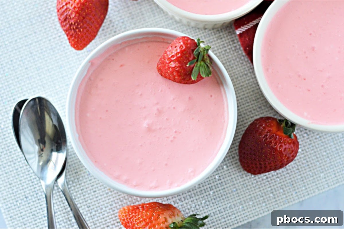 Airy Strawberry Keto Delight 3 Close-up of fluffy Low Carb Strawberry Jello Dessert in a glass bowl