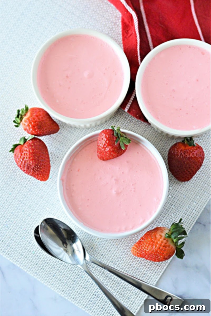 Airy Strawberry Keto Delight 7 Low Carb Strawberry Jello Fluff garnished with fresh strawberries