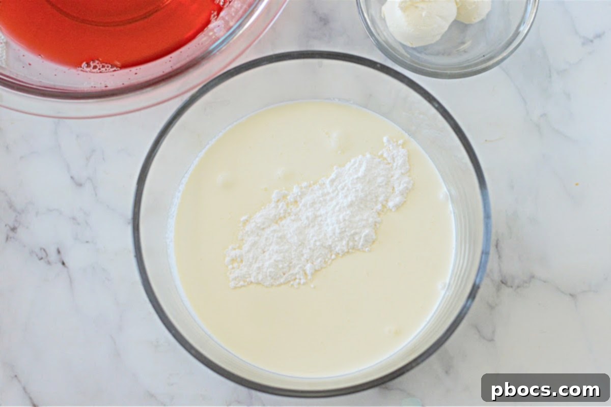 Airy Strawberry Keto Delight 10 Step 3: Adding ice water to cooled jello and stirring