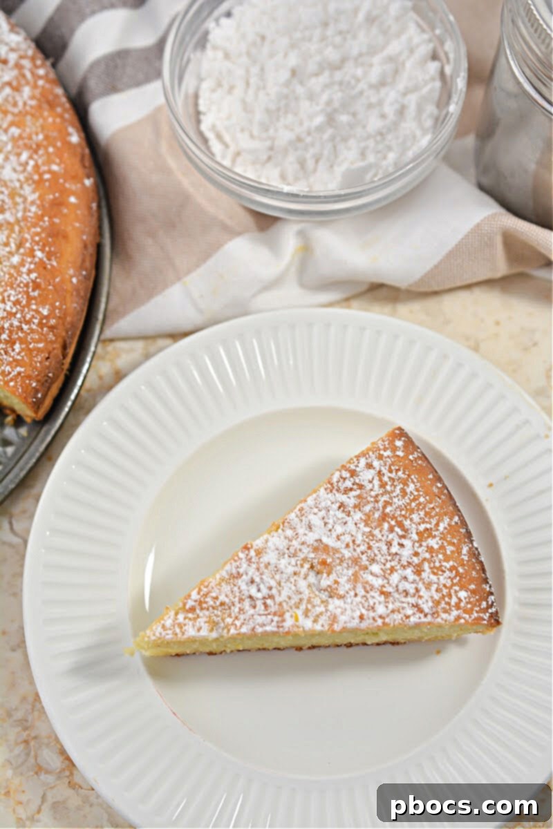 Keto Olive Oil Cake 7 Keto Olive Oil Cake - Two slices on a wooden board