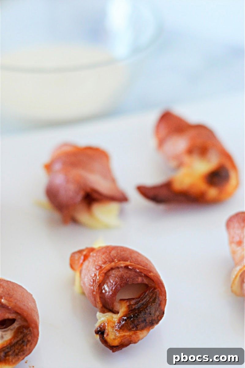 Step 4: Broiling bacon-wrapped mozzarella sticks until crispy