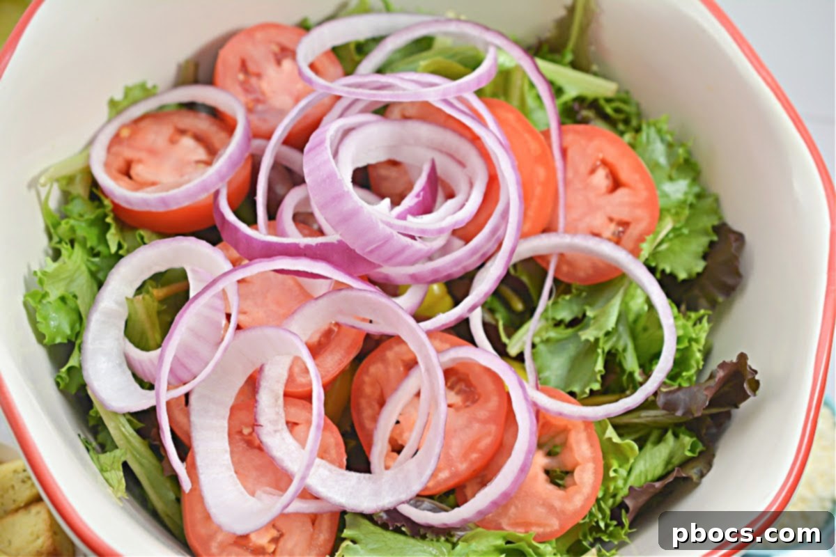 A jar of homemade keto dressing being shaken to combine the ingredients, demonstrating the easy preparation process.