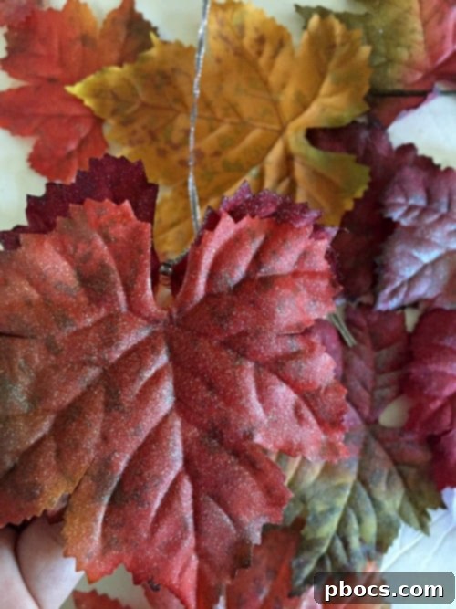 Stacked sparkly leaves ready for garland assembly