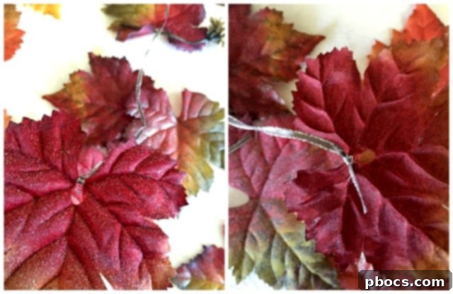 Attaching ribbon to a sparkly leaf for garland