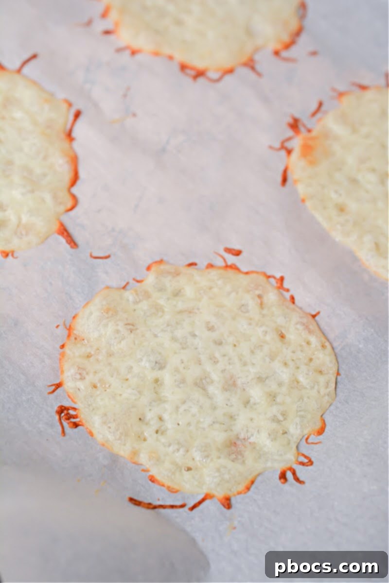 Mozzarella cheese circles on parchment paper