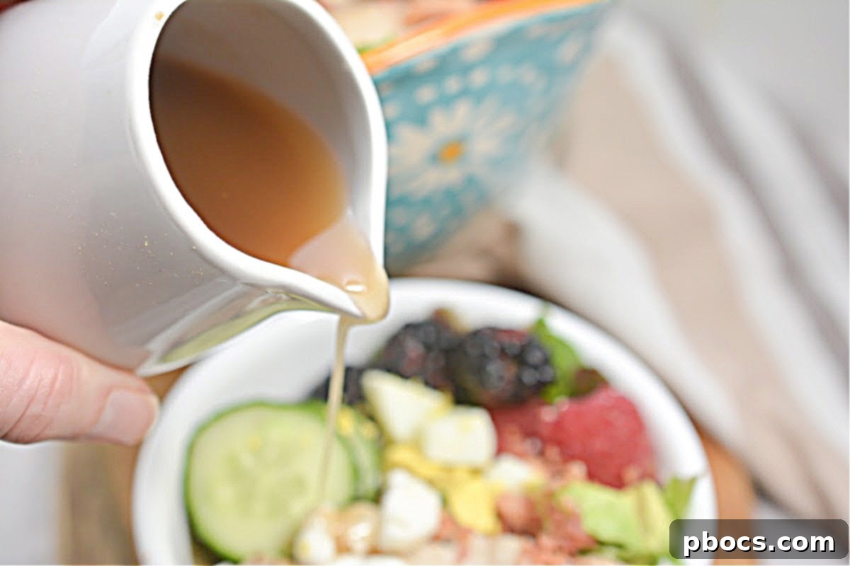 Berry Fresh Keto Cobb Salad 5 Homemade sugar-free balsamic vinaigrette in a clear bottle