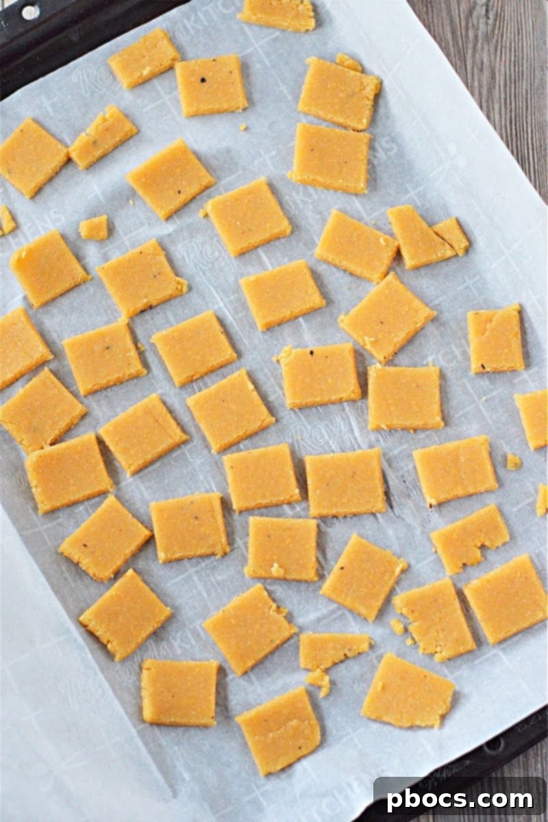 Keto Cheese Crackers arranged on a baking sheet before baking