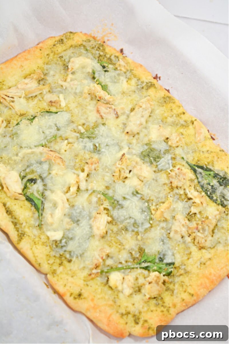 Sliced Keto Chicken Pesto Flatbread, ready to be served and enjoyed.