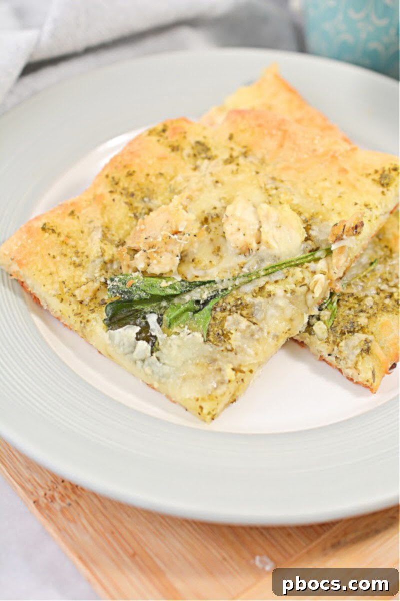 Keto Chicken Pesto Flatbread served alongside a bowl of delicious low-carb soup for a complete meal.