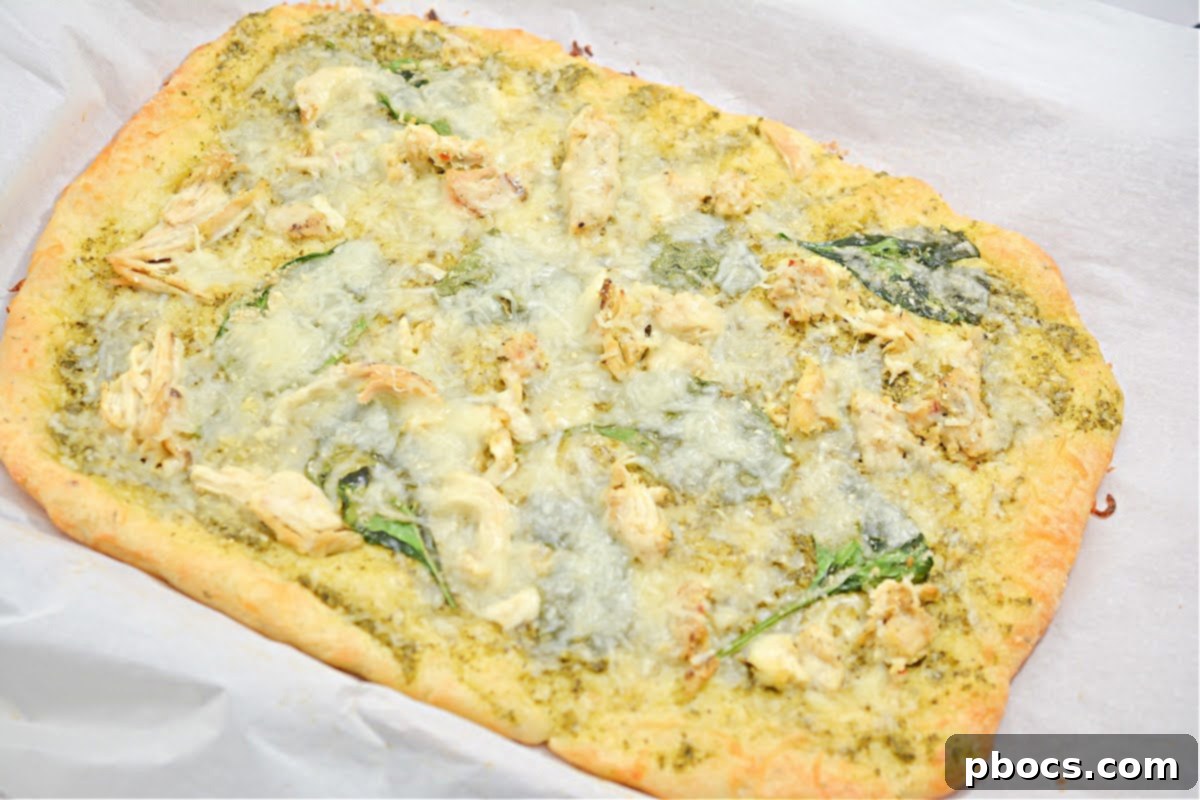 Another view of Keto Chicken Pesto Flatbread, ready to be enjoyed as a meal.