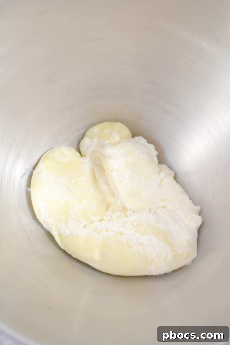 Melting mozzarella and cream cheese for the flatbread dough in a microwave-safe bowl.