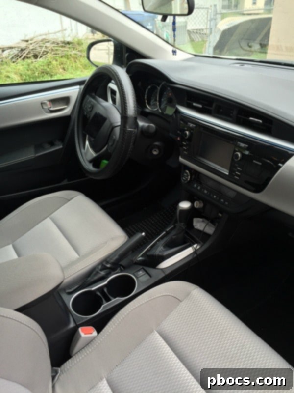 Clean car interior after vacuuming, organizing, and wiping down surfaces, looking neat and inviting