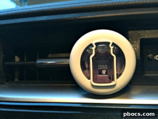 Yankee Candle Smart Scent Vent Clips and Car Jar Ultimate displayed elegantly in a car's interior