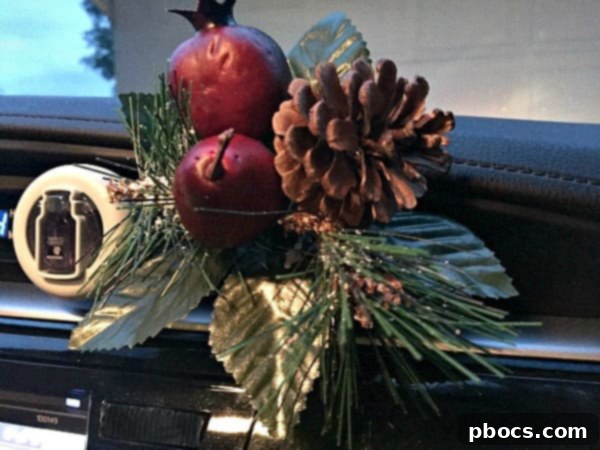 Yankee Candle Smart Scent Vent Clip in a car's air vent, subtly integrated with the car's interior design