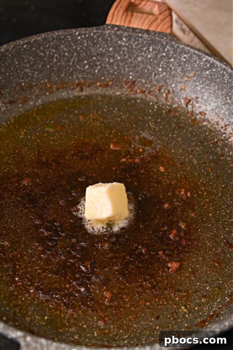 Spicy Keto Thai Meatballs 11 Removing cooked meatballs from skillet