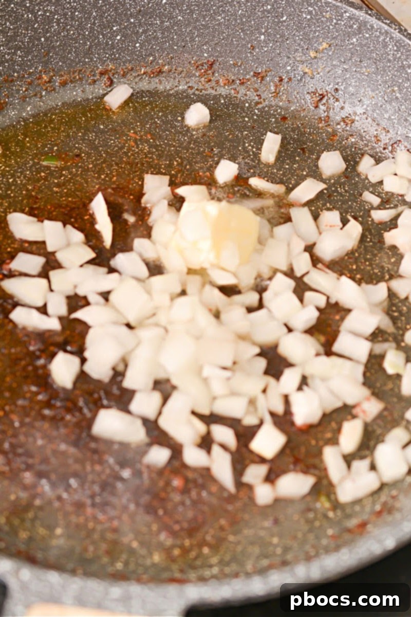 Spicy Keto Thai Meatballs 12 Sautéing onion and butter in skillet