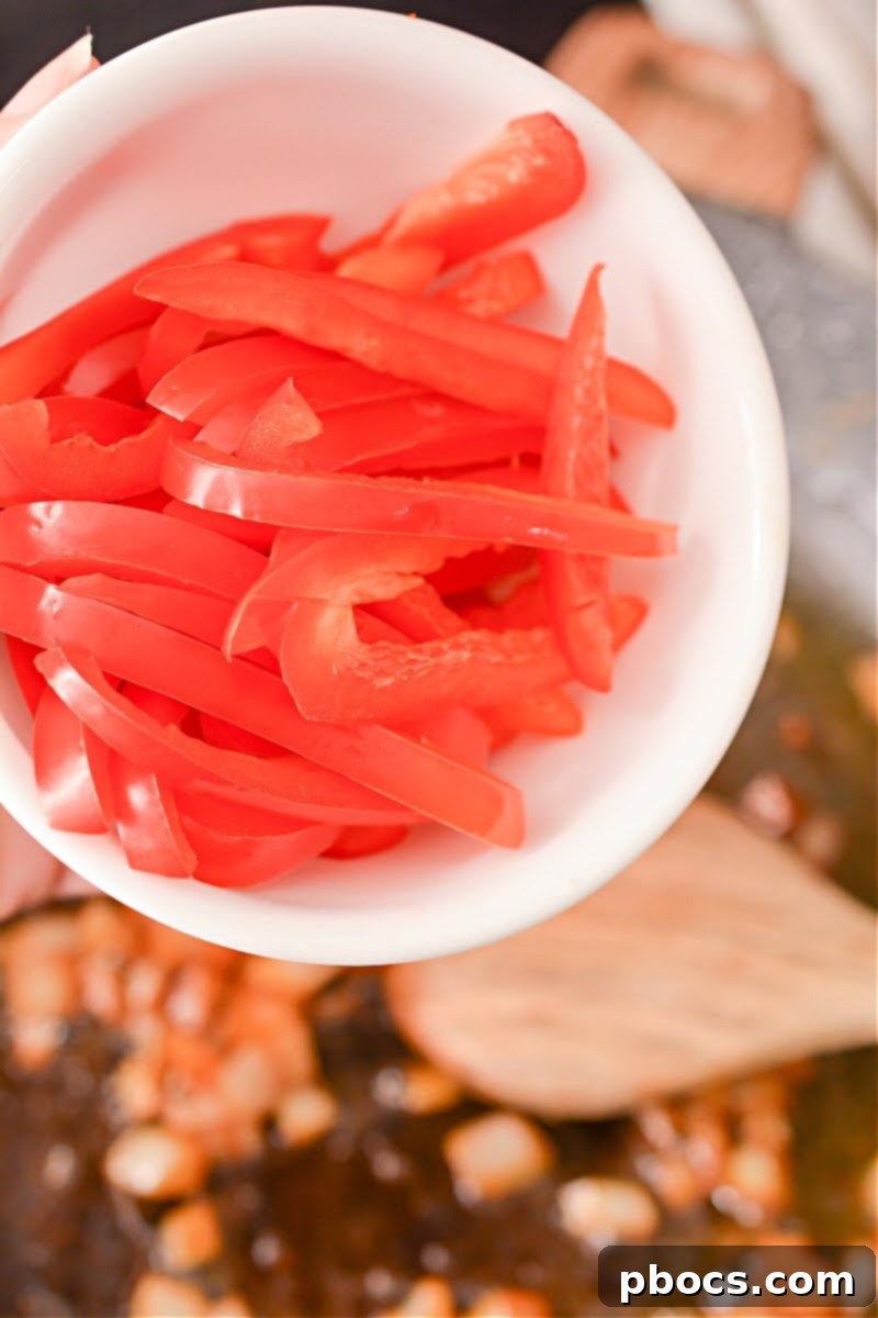 Spicy Keto Thai Meatballs 13 Onions softening in skillet