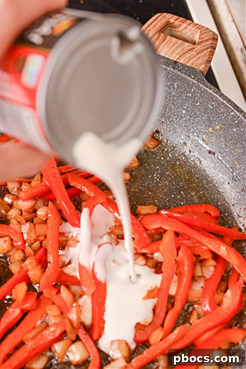 Spicy Keto Thai Meatballs 14 Adding red bell pepper to the skillet
