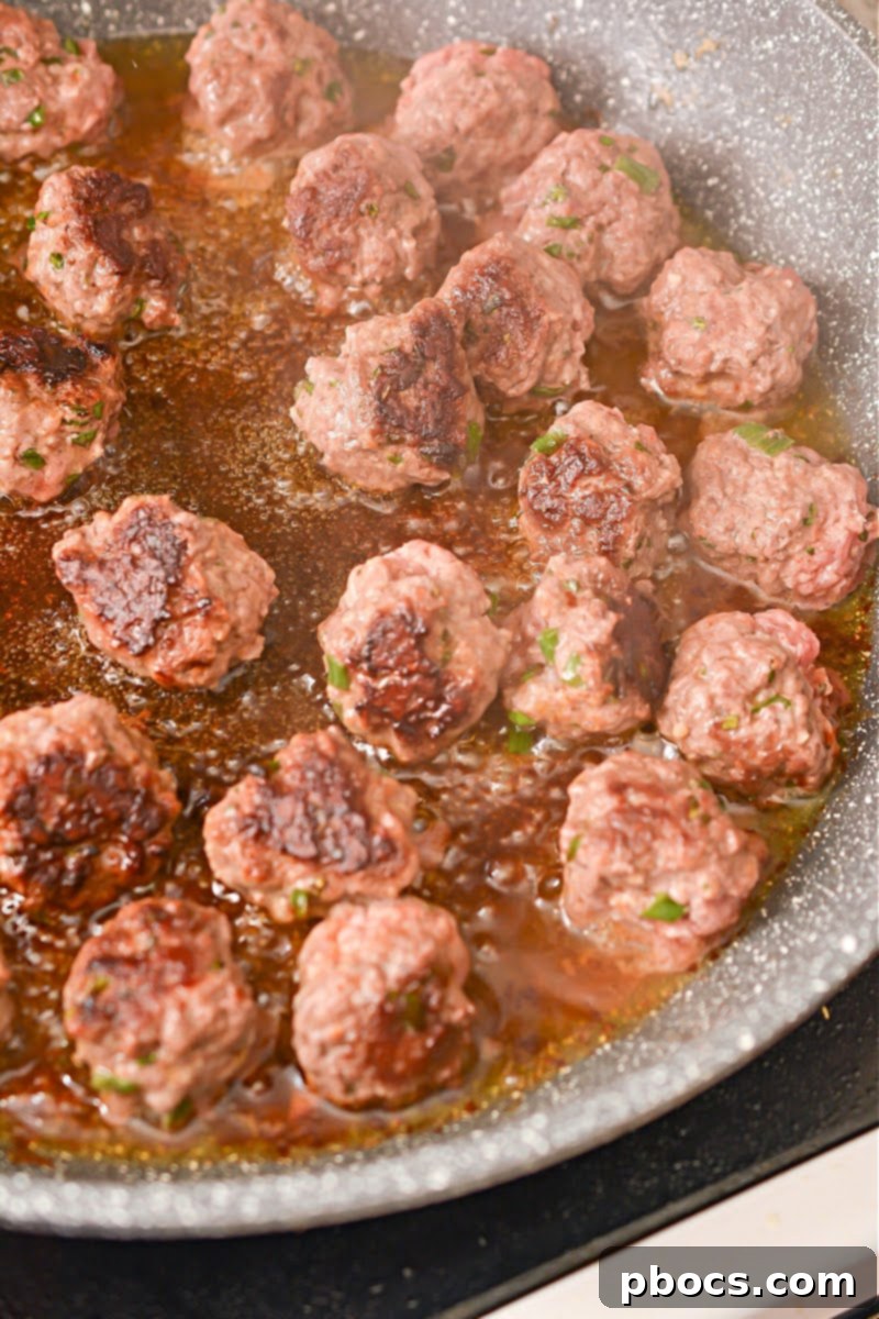 Spicy Keto Thai Meatballs 10 Heating olive oil in a skillet