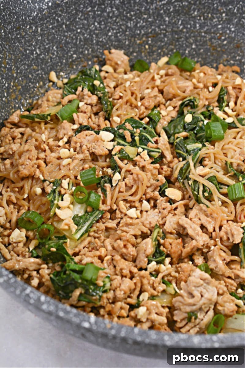 Combining Noodles and Sauce for Keto Dan Dan Noodles