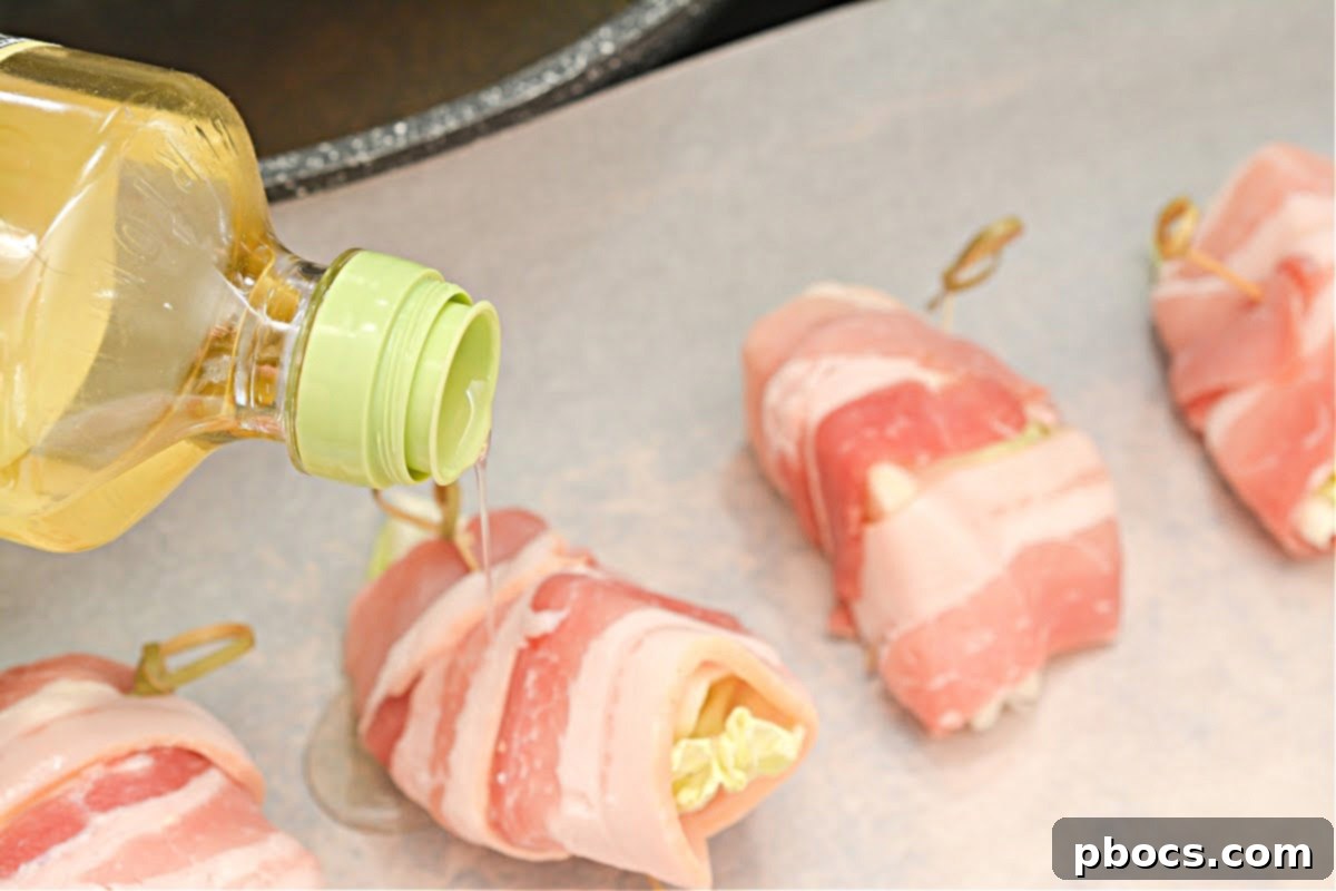 Savory Keto Bacon-Wrapped Cabbage 10 Step 3: Season bacon-wrapped cabbage with olive oil and spices