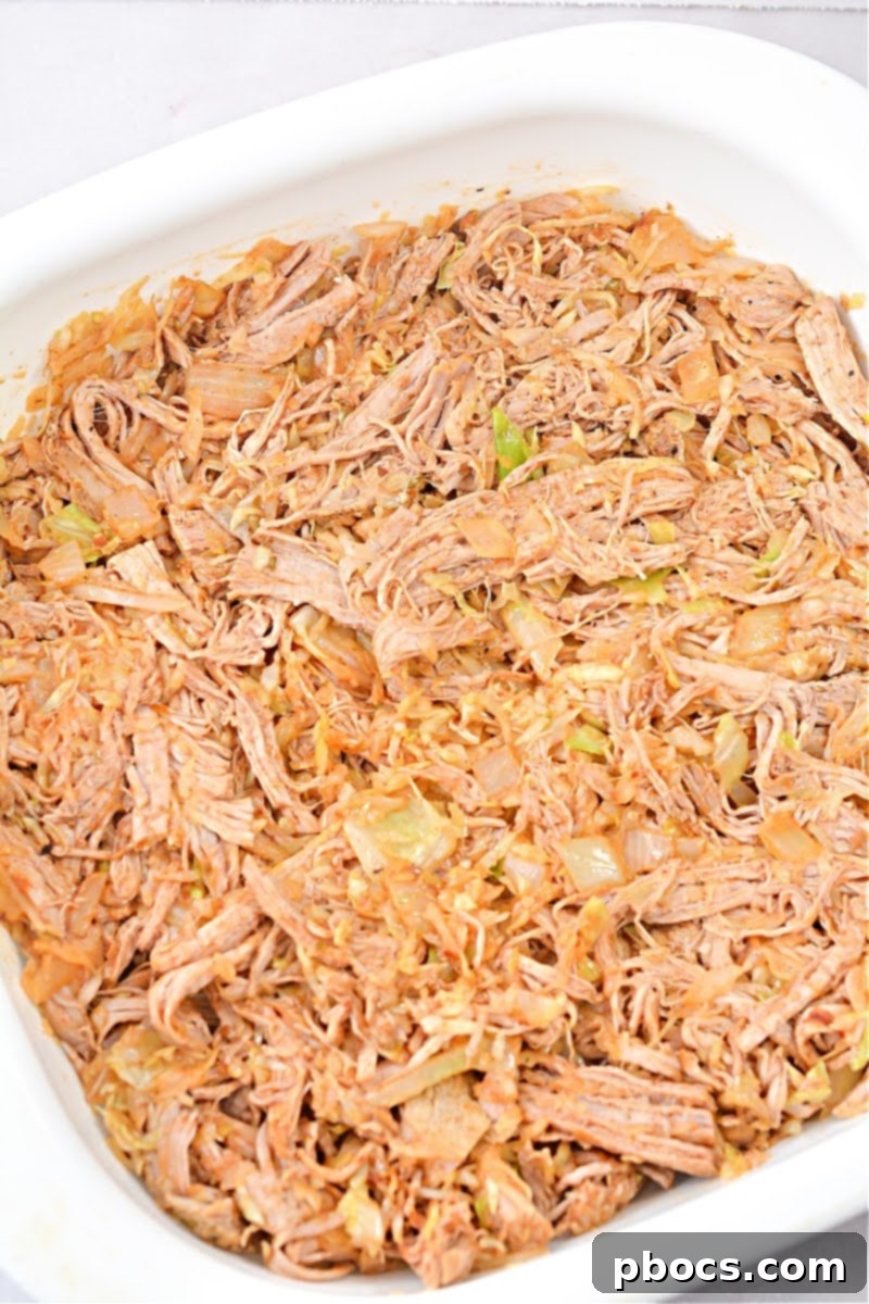 Keto Fiesta Pulled Pork Taco Casserole 13 Topping the casserole with shredded Monterey Jack cheese