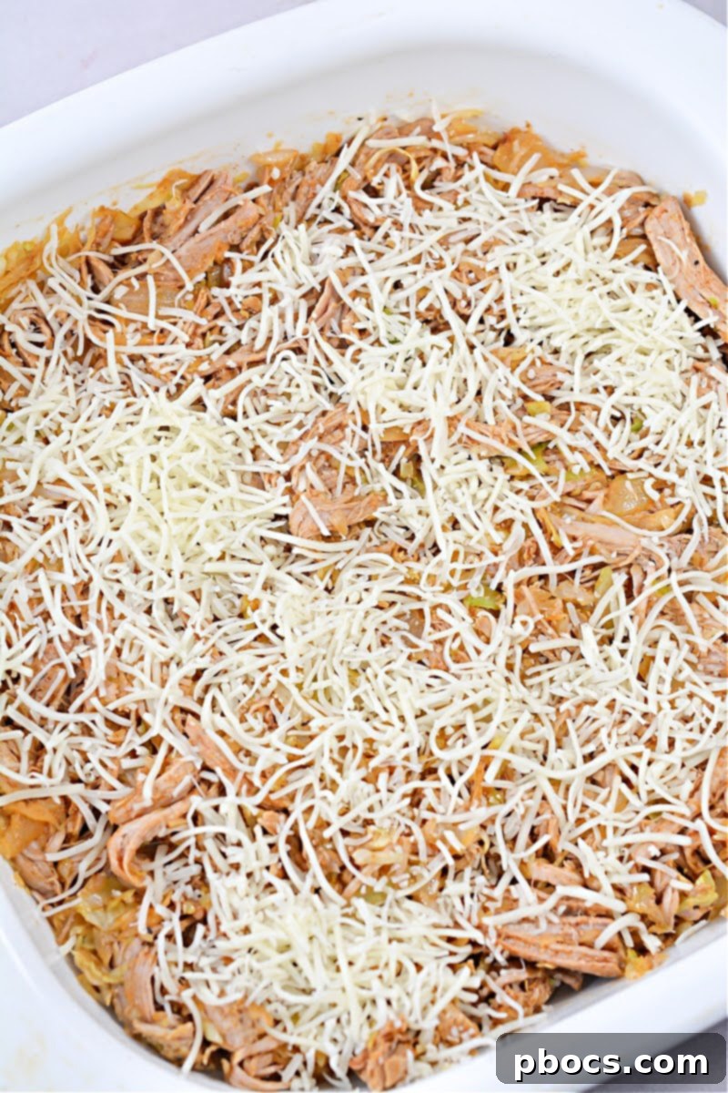 Keto Fiesta Pulled Pork Taco Casserole 14 Baked Keto Mexican Pulled Pork Casserole garnished and ready to serve