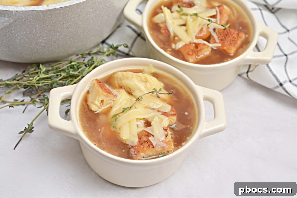 Keto French Onion Soup paired with a vibrant green salad, showcasing a balanced meal