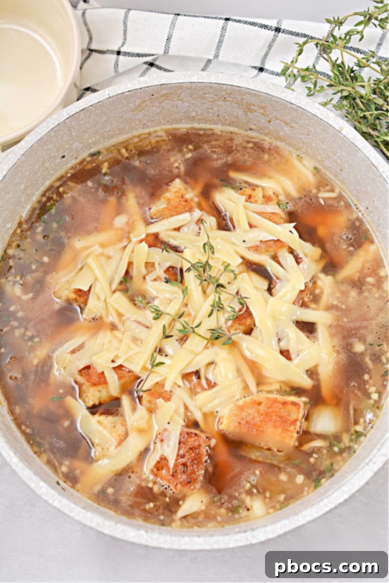 Keto French Onion Soup in a bowl with generous melted cheese topping