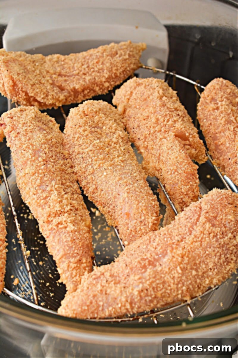 Crispy Keto Cajun Air Fryer Chicken Strips - cooking image 1