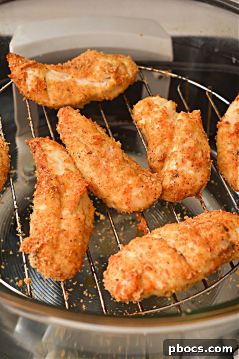 Crispy Keto Cajun Air Fryer Chicken Strips on a serving board