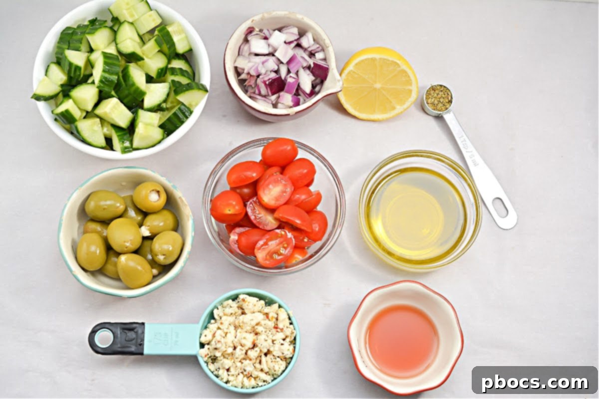 Keto Greek Cucumber Salad being prepared with various fresh vegetables