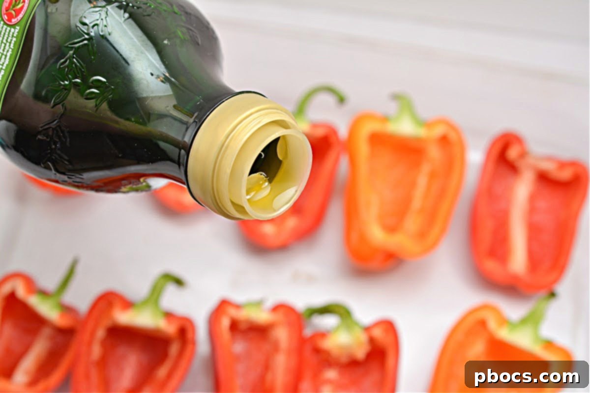 Hearty Keto Sausage Stuffed Bell Peppers 9 Bell peppers drizzled with olive oil in a casserole dish