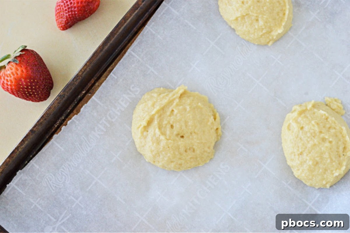 Two freshly baked Keto Strawberry Shortcakes ready for assembly