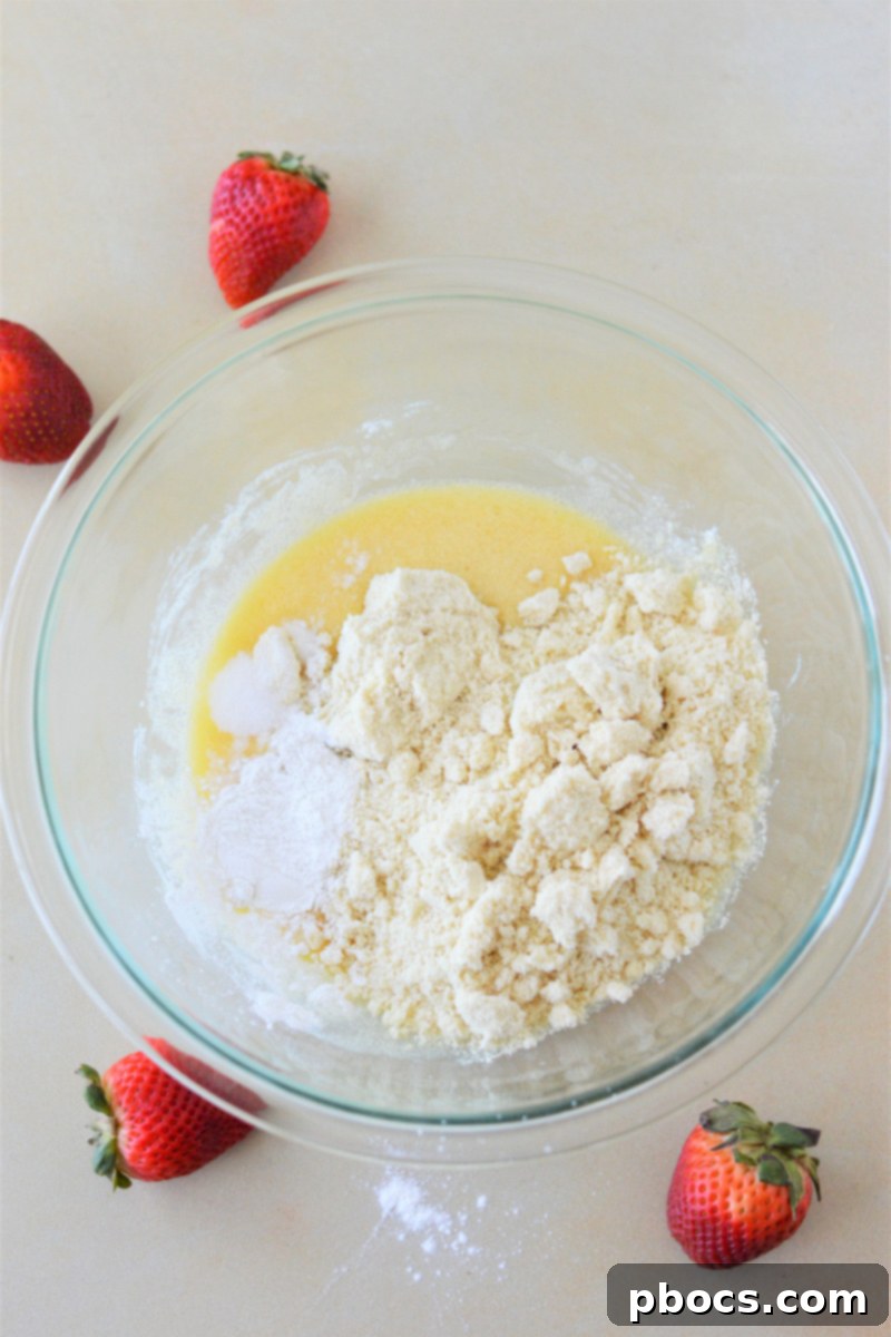Mixing wet ingredients for Keto Strawberry Shortcake batter