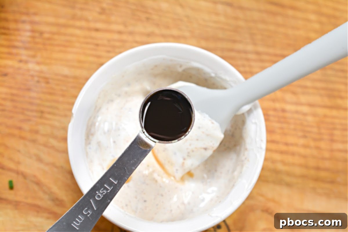 Draining cooked Keto Crab Cakes on paper towels.