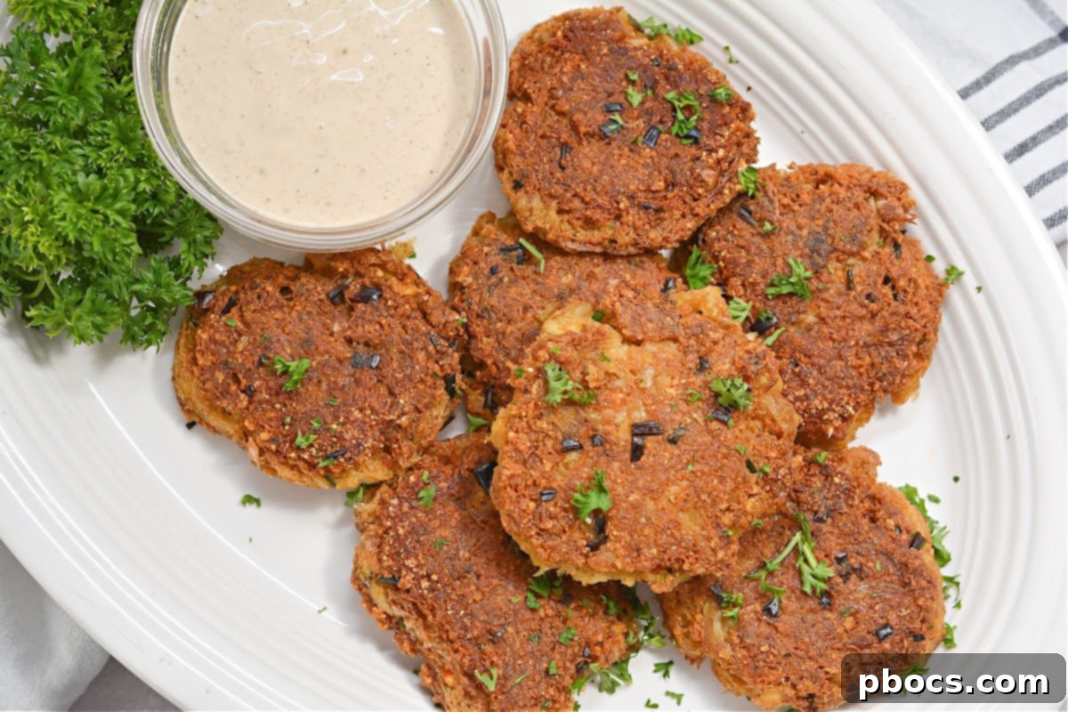 Close-up of golden brown Keto Crab Cakes, showcasing their appealing texture.