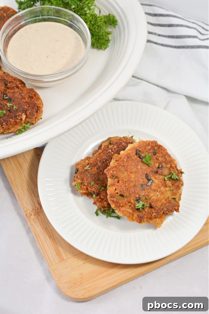 A stack of freshly made Keto Crab Cakes, ready to be enjoyed.