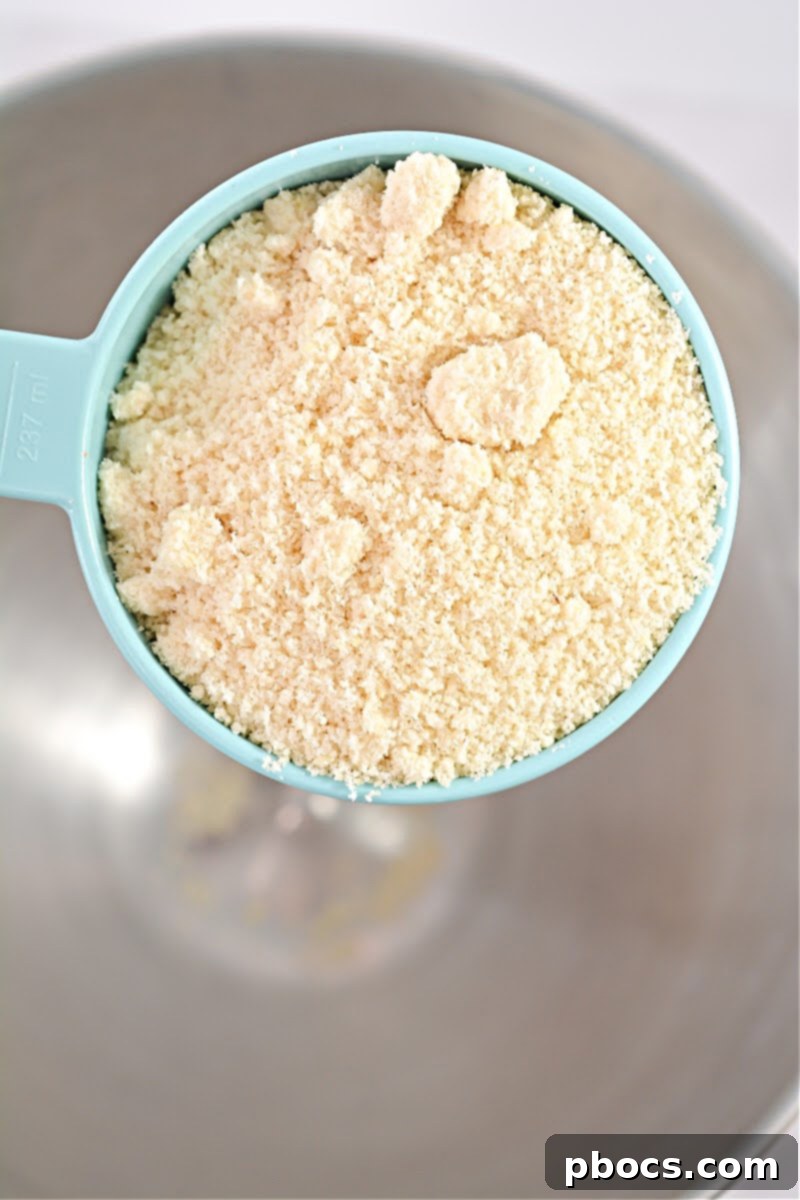 Close-up of baked Keto Raspberry Swirl Cake Bars, showing the golden crust and jam swirls.