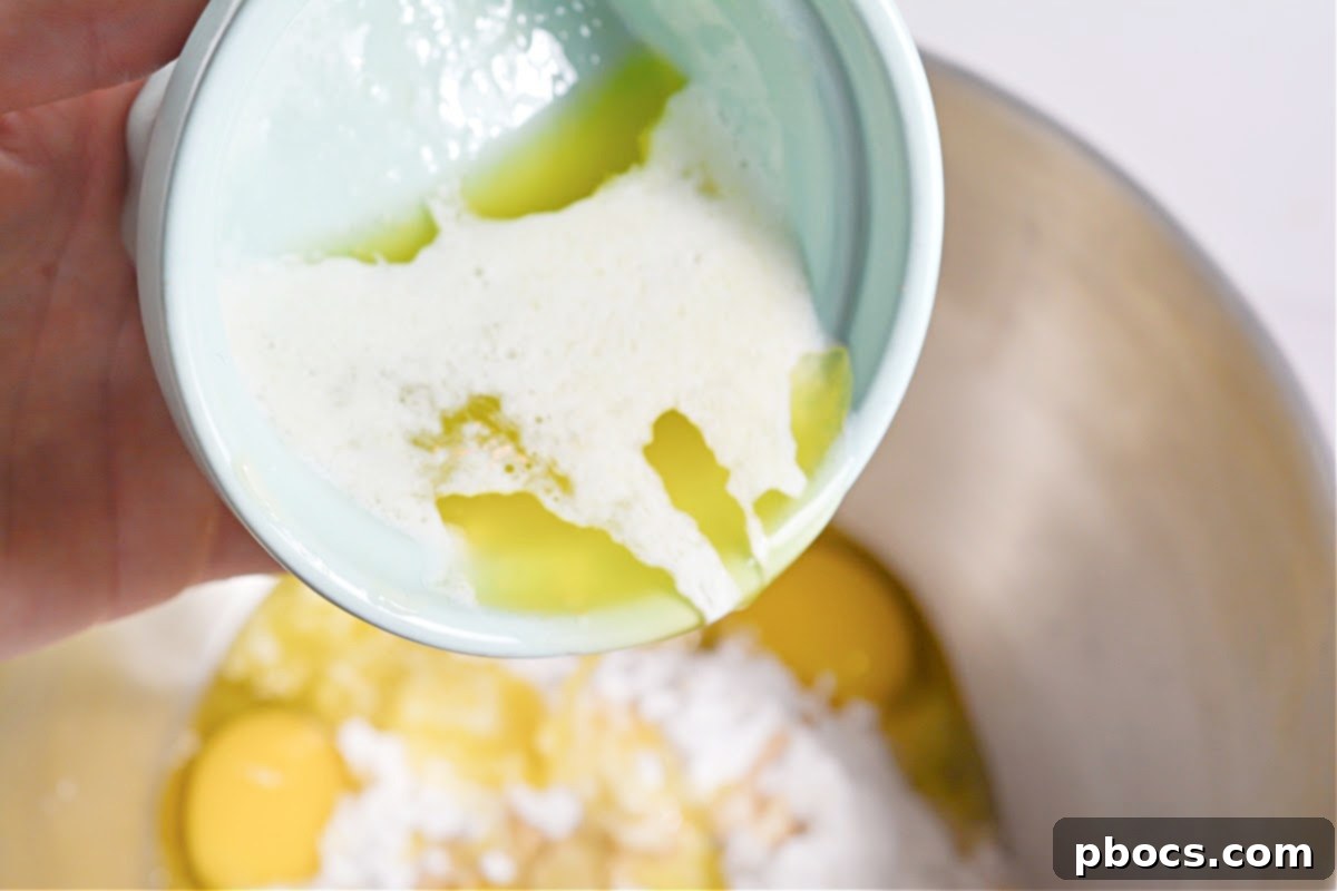 Mixing bowl with ingredients for Keto Raspberry Swirl Cake Bars.