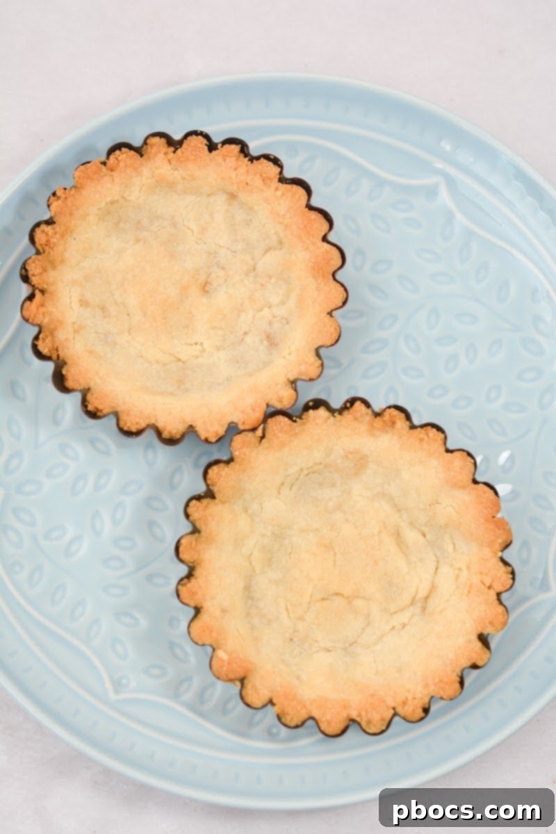 Delicious Keto Strawberry Mini Pies 11 Water and Swerve sugar substitute being heated in a pot