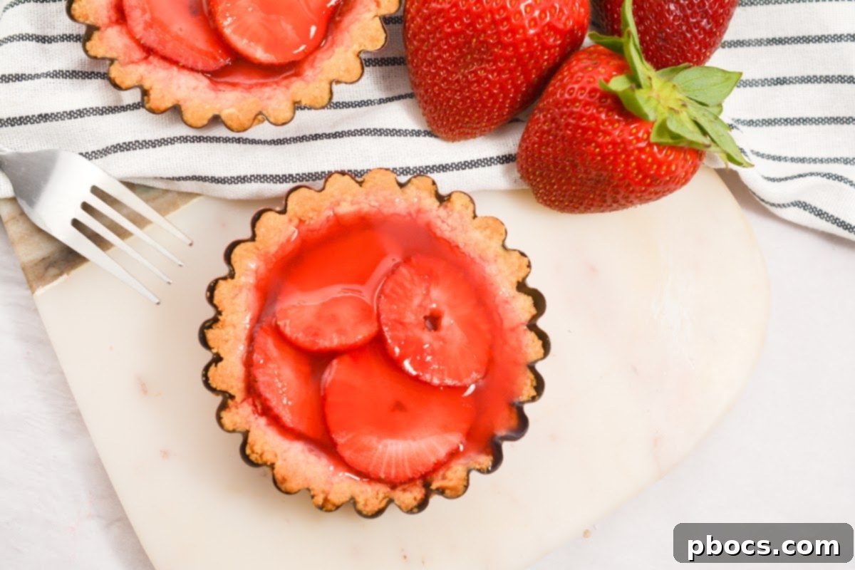 Delicious Keto Strawberry Mini Pies 3 Close-up of freshly baked Keto Strawberry Mini Pies with a golden crust